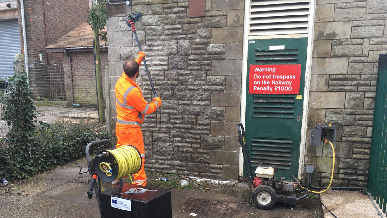 Worker deep cleaning a TfW station