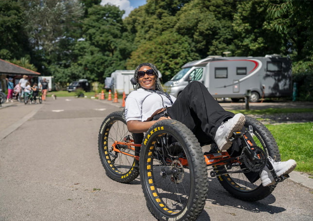 Woman on recumbant cycle / Menyw ar feic llorweddol